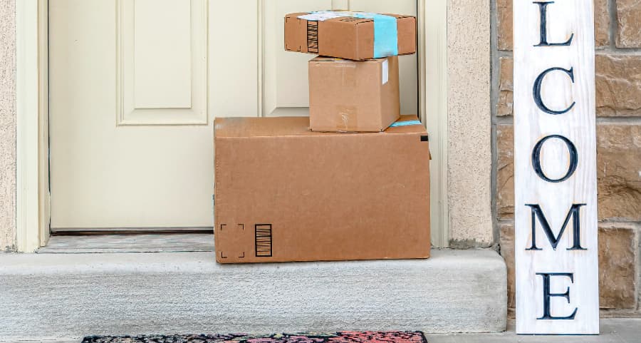 Deliveries on the front porch of a house with a welcome sign in Utica